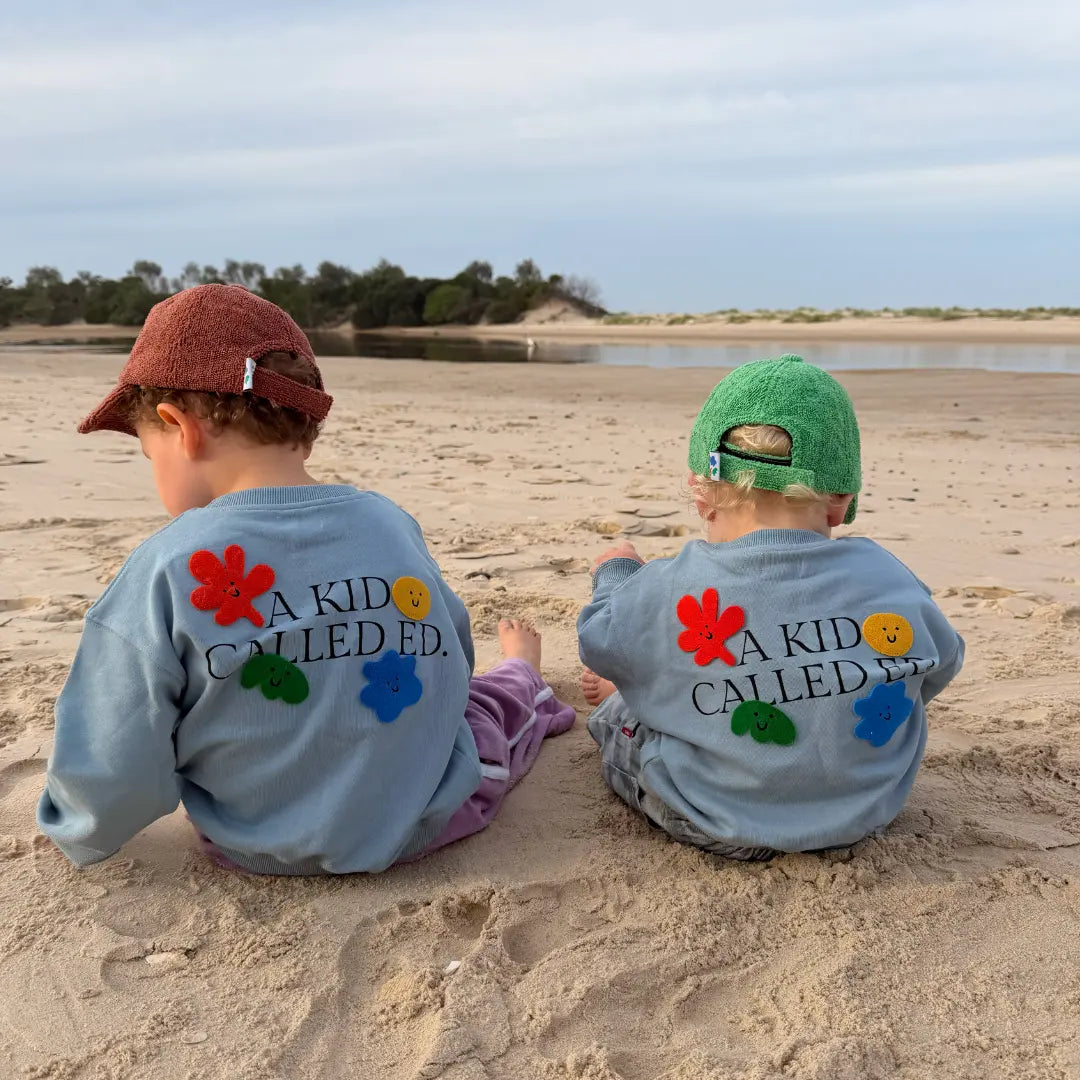 Two kids wearing organic cotton sweatshirts by A Kid Called Ed