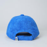 Blue textured cap on a light gray background