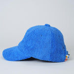 Blue textured cap on a light gray background