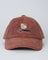 Brown textured cap with 'Tiny Rebel' logo and floral design on a light gray background
