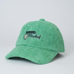 Green cap with 'Mood: Mischief' text on a light gray background
