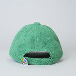 Green textured cap on a light gray background
