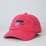 Red cap with 'Cool Kid' text and peace sign on a light gray background
