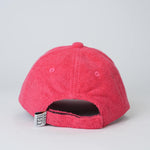 Red textured baseball cap on a light gray background