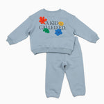 Light blue children's sweatshirt and pants set with colorful text and graphics on a white background
