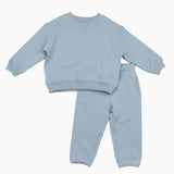 organic cotton Light blue children's sweatshirt and pants set on a white background