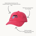 Red cap with 'Cool Kid' text and peace sign, labeled with features on a white background.