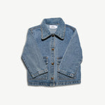 Kids organic cotton denim jacket shown from the front with the sleeves angled