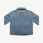 Back of the kids organic cotton denim jacket showing the leather logo patch