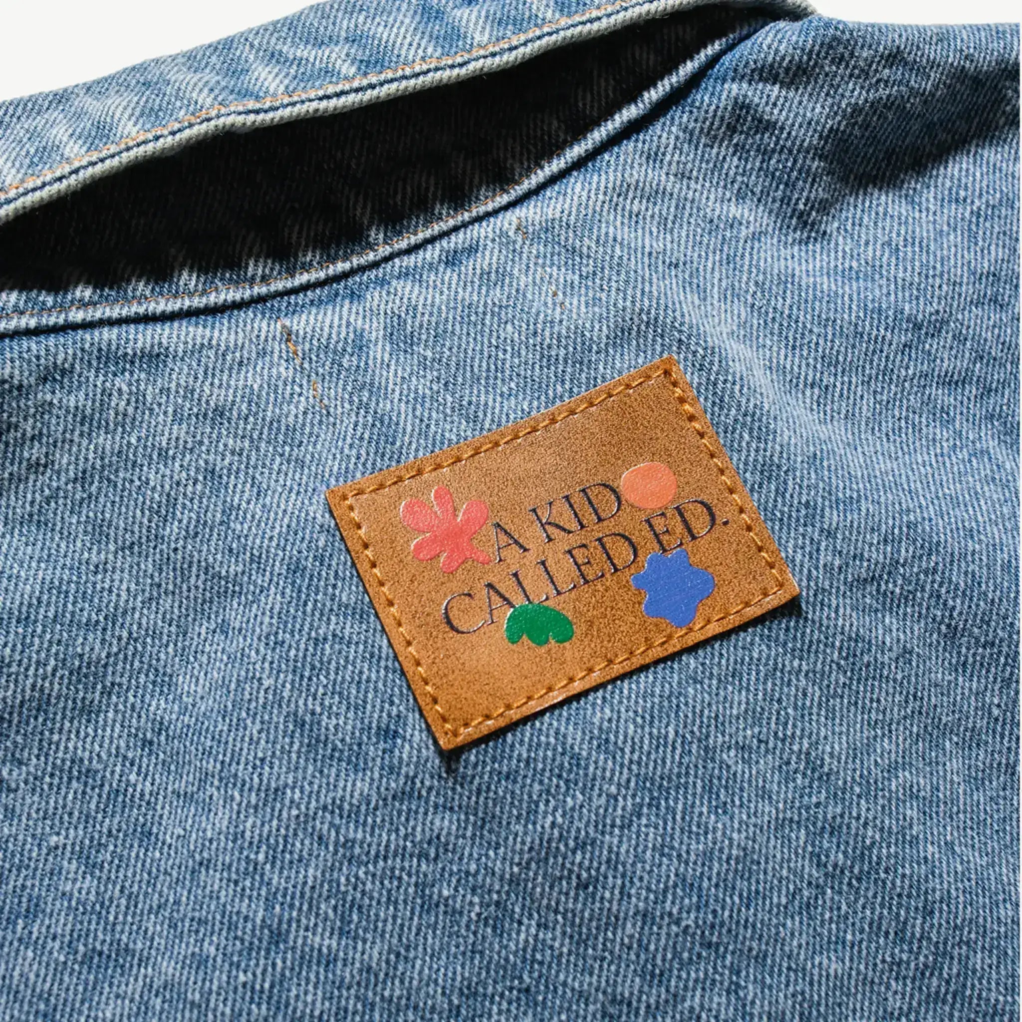 Close-up of the A Kid Called Ed leather patch on the back of the denim jacket