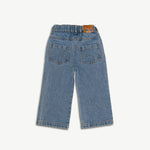 Back view of the kids organic cotton denim jeans showing the pocket and leather patch