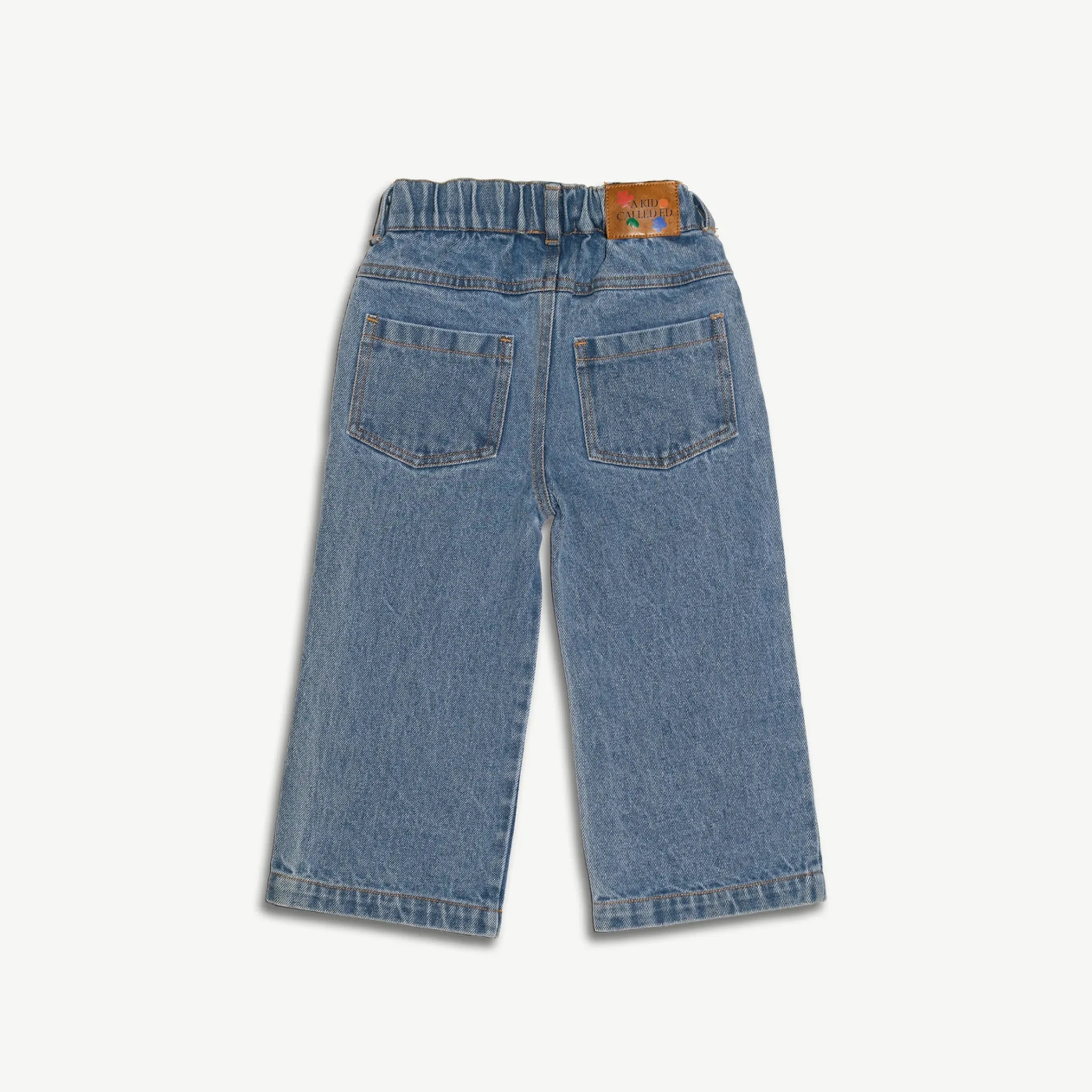 Back view of the kids organic cotton denim jeans showing the pocket and leather patch