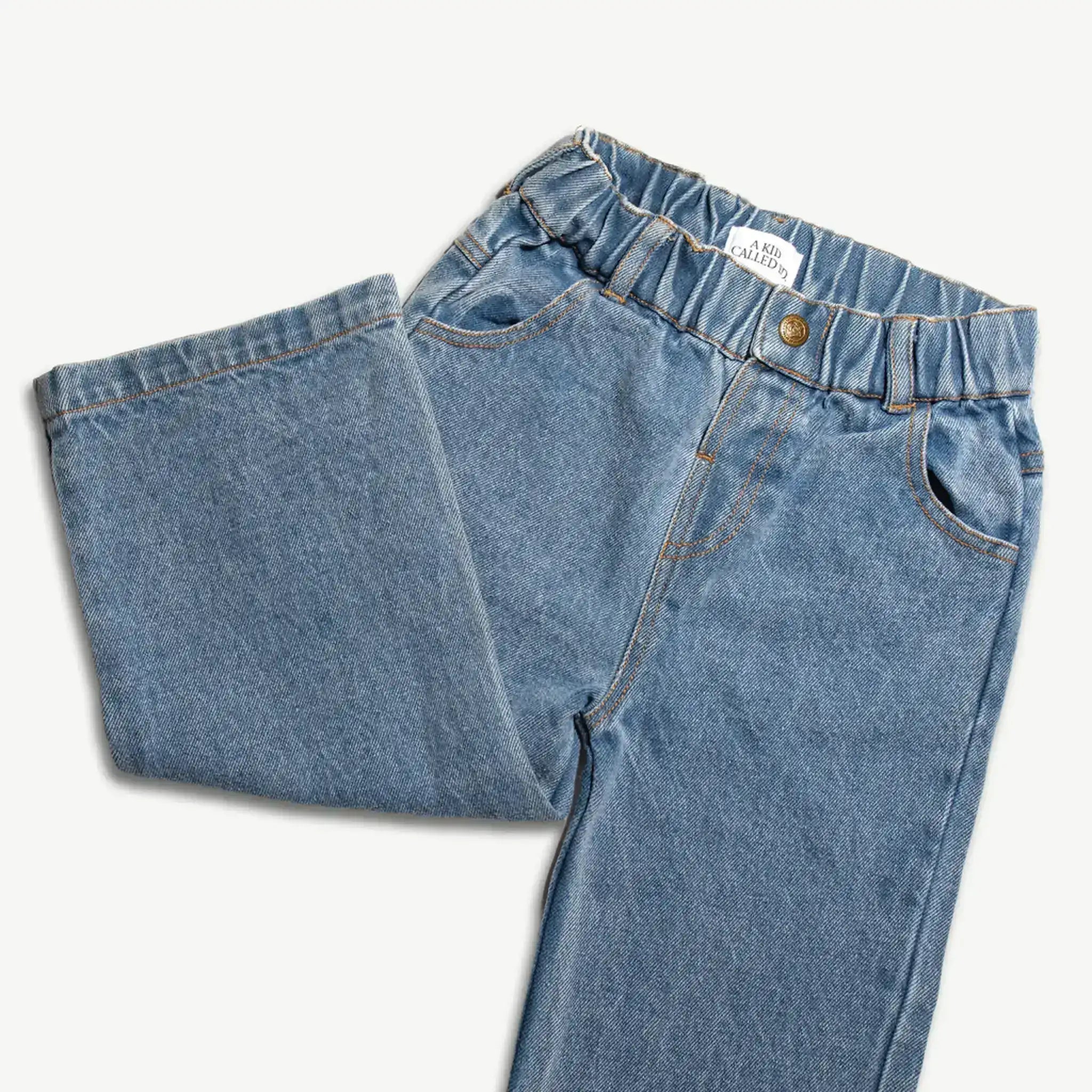 Kids organic cotton denim jeans folded to show the leg and elasticated waist