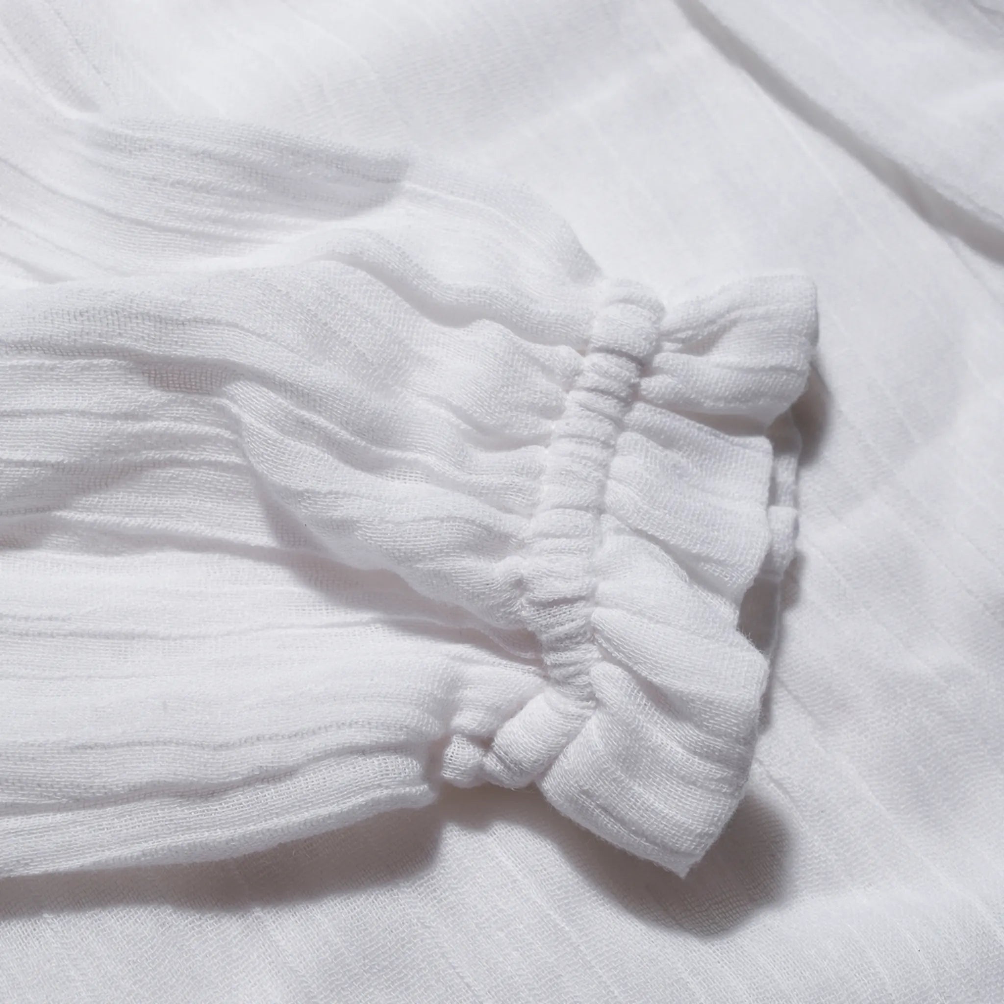 Close-up of the elasticated cuff on the long sleeve muslin blouse