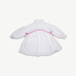 Back view of the kids organic cotton muslin dress with pink trim