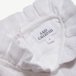 Close-up of the A Kid Called Ed woven label inside the muslin dress